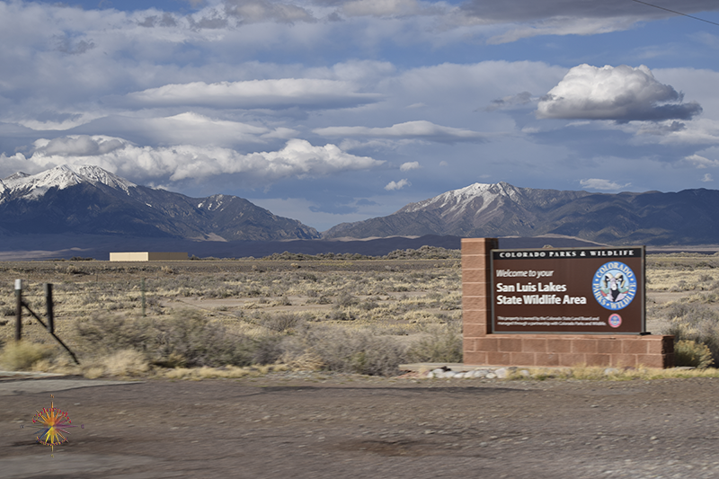 About twelve miles on Lane 6 N you come to the entrance of San Luis Lakes State Park heading to Great Sand Dunes National Park in Coming down CO-17 the Cosmic Highway turn left at Moca on Lane 6 N toward CO-150 to the Great Sand Dunes National Park in Great Sand Dunes Ep-1