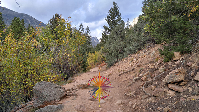Fall hikes offer varied contrast of colors through the Rocky Mountains on Fern Lake Trail Rocky Mountain National Park