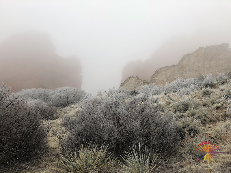 Dimensions of depth is enhanced by rock color, frost and fog in Garden of the Gods Colorado Springs Colorado