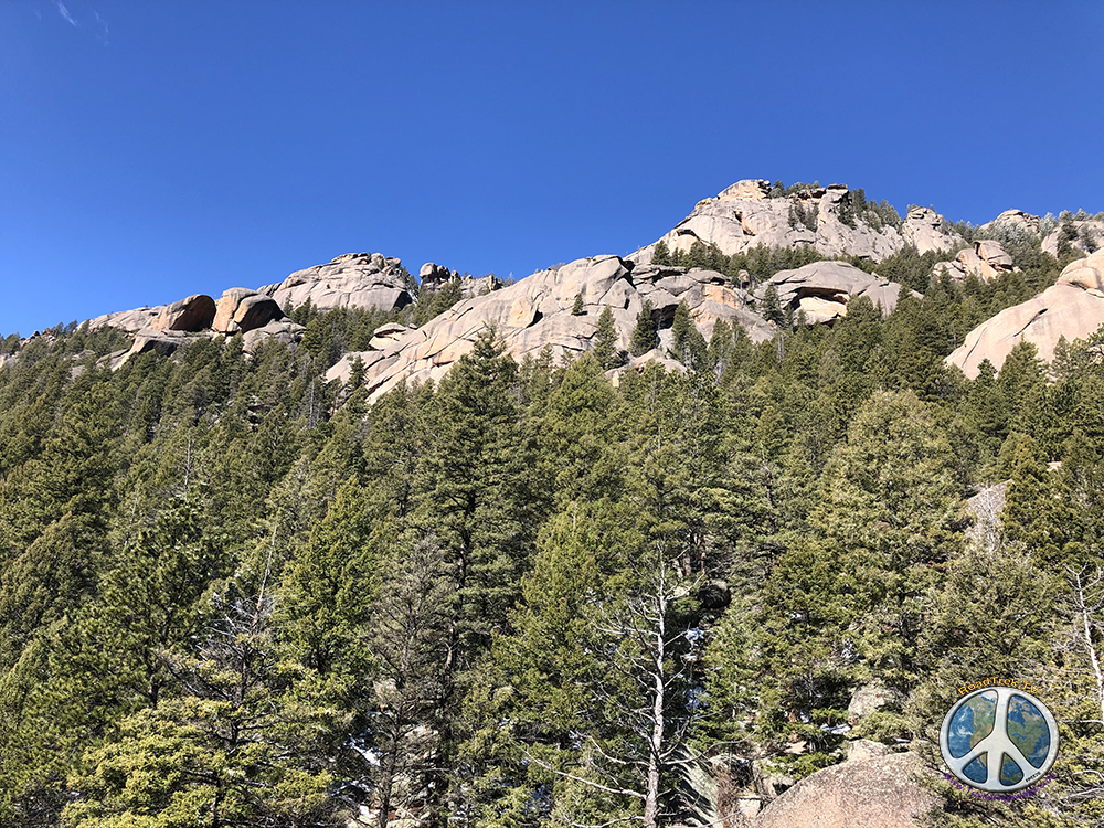 Looking back over my shoulder at rock peaks in Lost Creek Wilderness wearing hiking clothes Hike Harmonica Arch Similitude 1-8