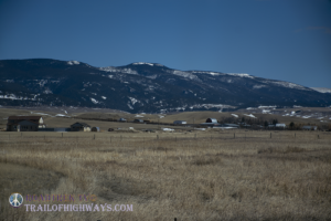 Ranching community nestled against the mountains.